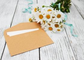 bouquet of daisies with envelope photo