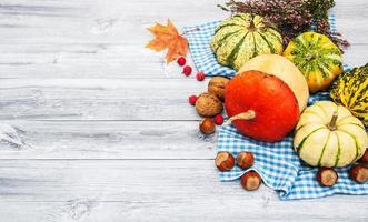 Pumpkins with autumn leaves photo