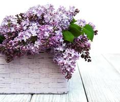 Lilac flowers on table photo