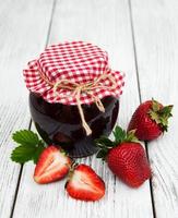 Strawberry jam and fresh strawberries photo