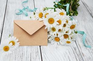 bouquet of daisies with envelope photo