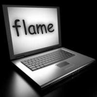 flame word on laptop photo