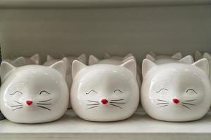 cats from porcelain Souvenirs on the counter photo