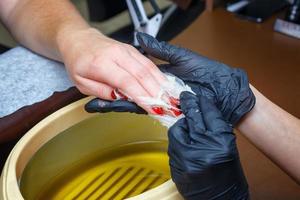 hand care with hot wax, covering with wax, manicure salon photo