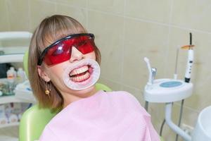 the woman on reception at the dentist , whitening of teeth and prevention