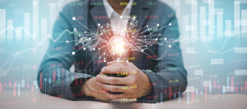 business hand holding light bulb with line connect and working on desk, Creativity and innovation are keys to success.Concept of new idea and innovation with energy and power. photo