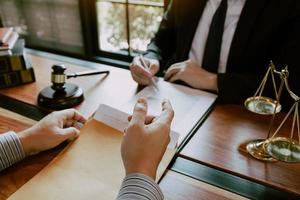 Clients come to seek advice for the law regarding privacy violations with the lawyer at the office. photo