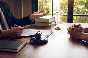 Business lawyer is currently counseling the client's trial at the lawyer office. photo