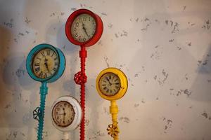 Creative multi-colored vintage clock in loft style photo