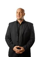 Portrait of a bald man in a black shirt and jacket on a white background, businessman photo