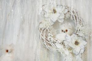 beautiful decor, white wreath with flowers and little white owl photo