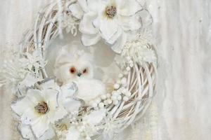 beautiful decor, white wreath with flowers and little white owl photo