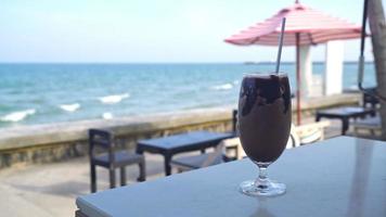 ice chocolate milkshake with ocean sea background video