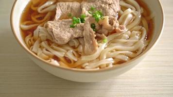 homemade udon ramen noodles with pork in soy or shoyu soup video