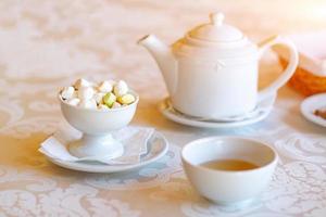 On the table a kettle, a Cup and a bowl of parvarda, photo