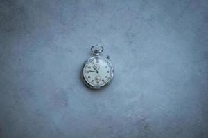 pocket watch on a marble background photo