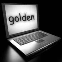 palabra dorada en la computadora portátil foto