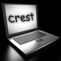 crest word on laptop photo