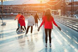 portrait of a beautiful girl at the rink in winter photo