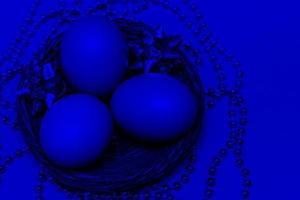 Eggs in a basket on a classic blue background, photo