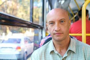 Bus interior with passengers. Passengers in a city bus. Modern public transport photo