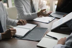 Group of businessmen are disputing about the wrong financial budget of the company and sharing the correct analysis. photo