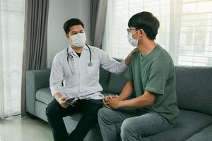 Doctor visit patients at home and follow-up the results treatment while providing confidence to patients at home during the outbreak of a new strain of coronavirus. photo