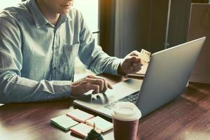 Men using laptop for shopping online and earn points to website. photo