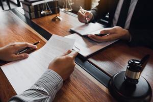 Lawyer is providing information about the client's trial at the lawyer office. photo