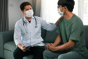 Doctor visit patients at home and follow-up the results treatment while providing confidence to patients at home during the outbreak of a new strain of coronavirus. photo