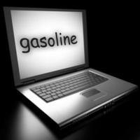 palabra de gasolina en la computadora portátil foto