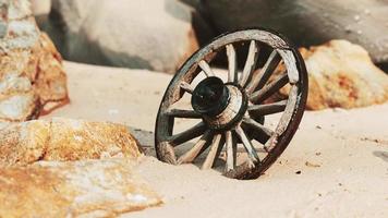 old tradition waggon wheel on the sand video