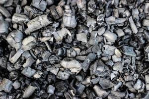 Black charcoal or coal carbon texture for background photo