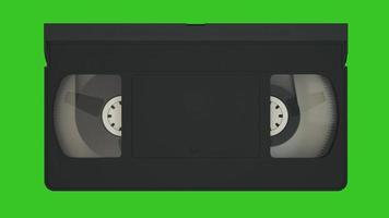 VHS cassette. Old video tape record system. Video cassette isolated on green screen. 3d rendering photo
