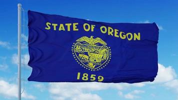 Oregon flag on a flagpole waving in the wind, blue sky background. 3d rendering photo