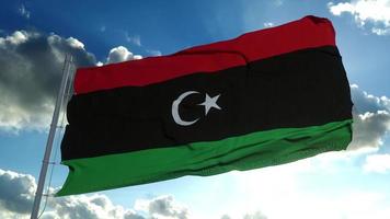 Libya National flag waving in the wind, blue sky background. 3d rendering photo