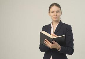 Happy beautiful business woman with clipboard photo