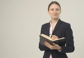 Happy beautiful business woman with clipboard photo