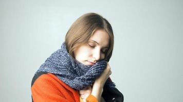 Ill young woman feeling cold having flu grippe symptoms covered with blanket, sick teen girl shivering freezing at home wrapped with plaid, no heating problem and fever temperature flue concept photo