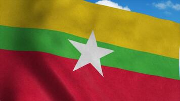 bandera de myanmar en un asta de bandera ondeando en el viento, fondo de cielo azul. representación 3d foto