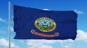 Idaho flag on a flagpole waving in the wind, blue sky background. 3d rendering photo