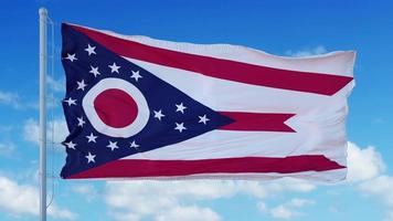 Ohio flag on a flagpole waving in the wind, blue sky background. 3d rendering photo