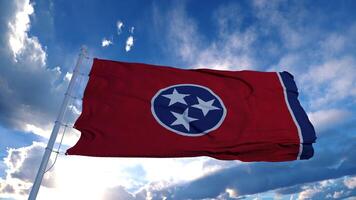 bandera de tennessee en un asta de bandera ondeando en el viento, fondo de cielo azul. representación 3d foto