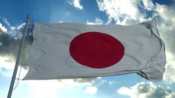 The national flag of Japan flutters in the wind against a blue sky. 3d rendering photo