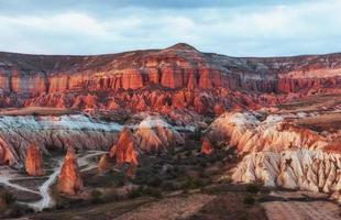 Red valley at Cappadocia, Anatolia, Turkey. Volcanic mountains i photo