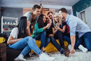 Group portrait of Cheerful old friends communicate with each other, friend posing on cafe, Urban style people having fun, Concepts about youth togetherness lifestyle. Wifi connected photo