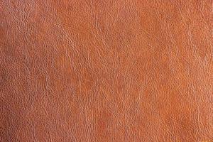 Fondo de textura marrón de cuero sintético de primer plano. resumen de cuero de la vendimia foto