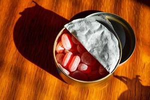 Cherry fresh breath sweet candies in metal can on the table photo