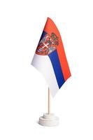 Small table flag of Serbia isolated on white background photo