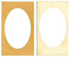 Old cardboard photo frame with ellipse vignette and empty space inside isolated on white background. Mock up